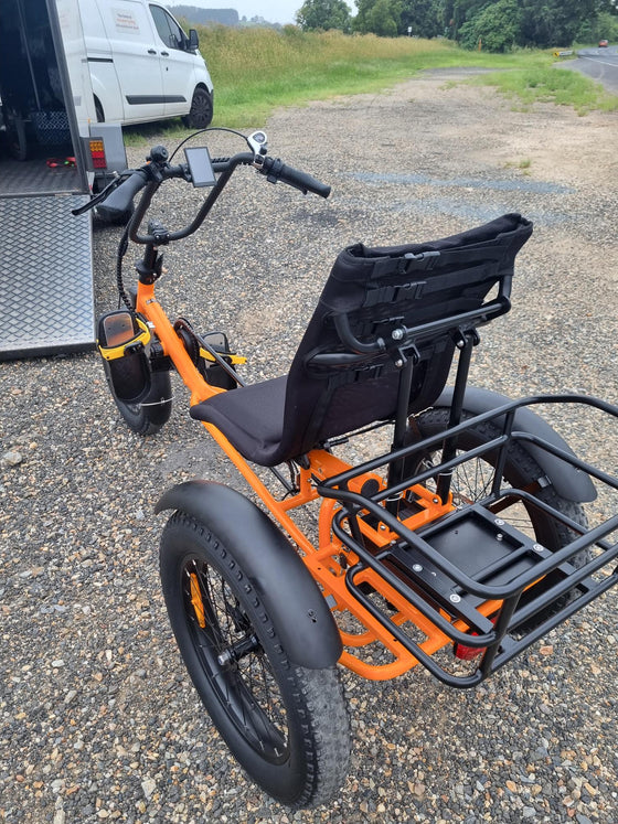 Back view of a orange Trident FT fat-tyre semi-recumbent electric tricycle