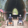 Two guys going on a ride through tunnel