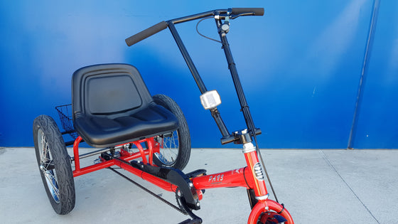 Close up of seat on red Worksman Personal Activity Vehicle Electric Tricycle