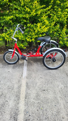  Side profile of red Muskateer 16" standard mechanical tricycle