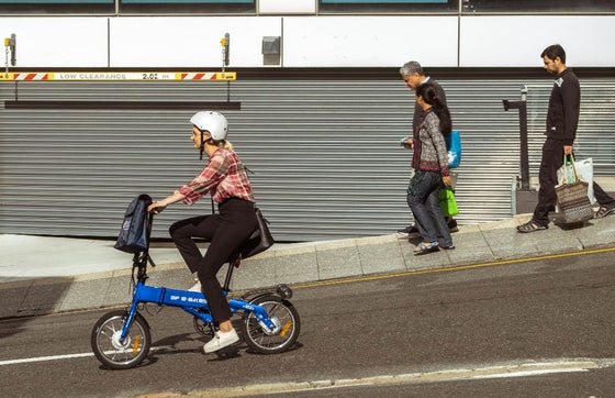 Lady riding the blue BF i-Ezi Folding Electric Bike