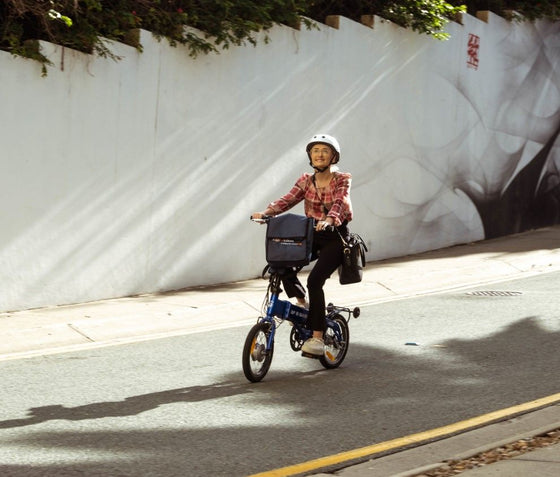 Lady riding the BF i-Ezi Folding Electric Bike in the street