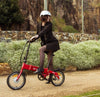 Women riding the red BF i-Ezi Folding Electric Bike