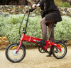 Lady stepping on the BF i-Ezi Folding Electric Bike