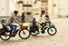 Family riding Benno Boost electric long-tail cargo bike together