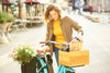 Smiling lady shopping with Benno EJoy electric cargo bike