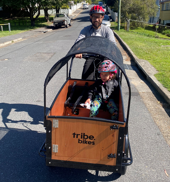 Man riding with child at the front on a ORIGINAL BOX CARGO BIKE - ELECTRIC PLUS MODEL