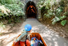 Kid riding through a tunnel