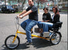 Happy people riding a Worksman Chariot electric tricycle