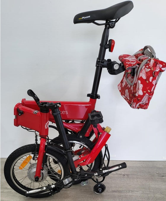 Red BF i-Ezi Folding Electric Bike in the process of being folded smaller