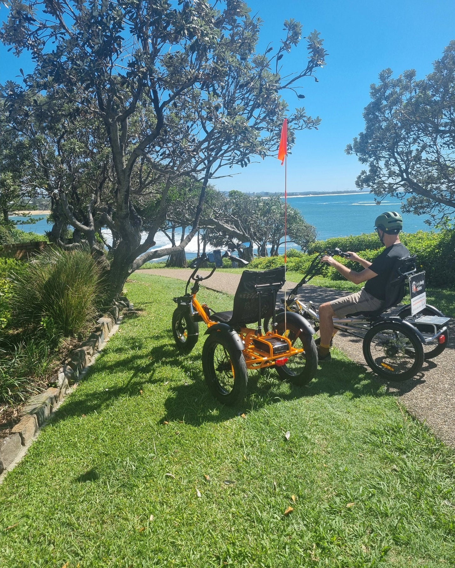 Richard on our electric trikes down by the water