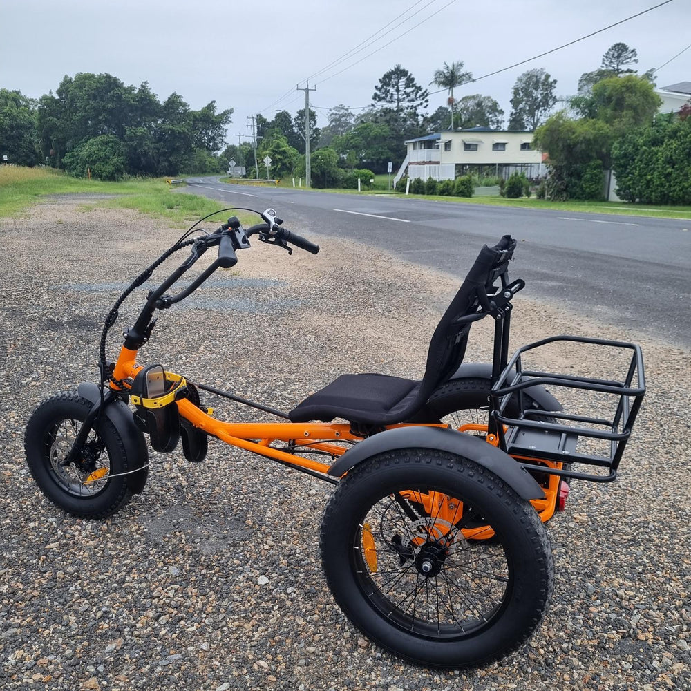 
                  
                    Side profile of orange coloured Trident FT fat-tyre semi-recumbent electric tricycle
                  
                