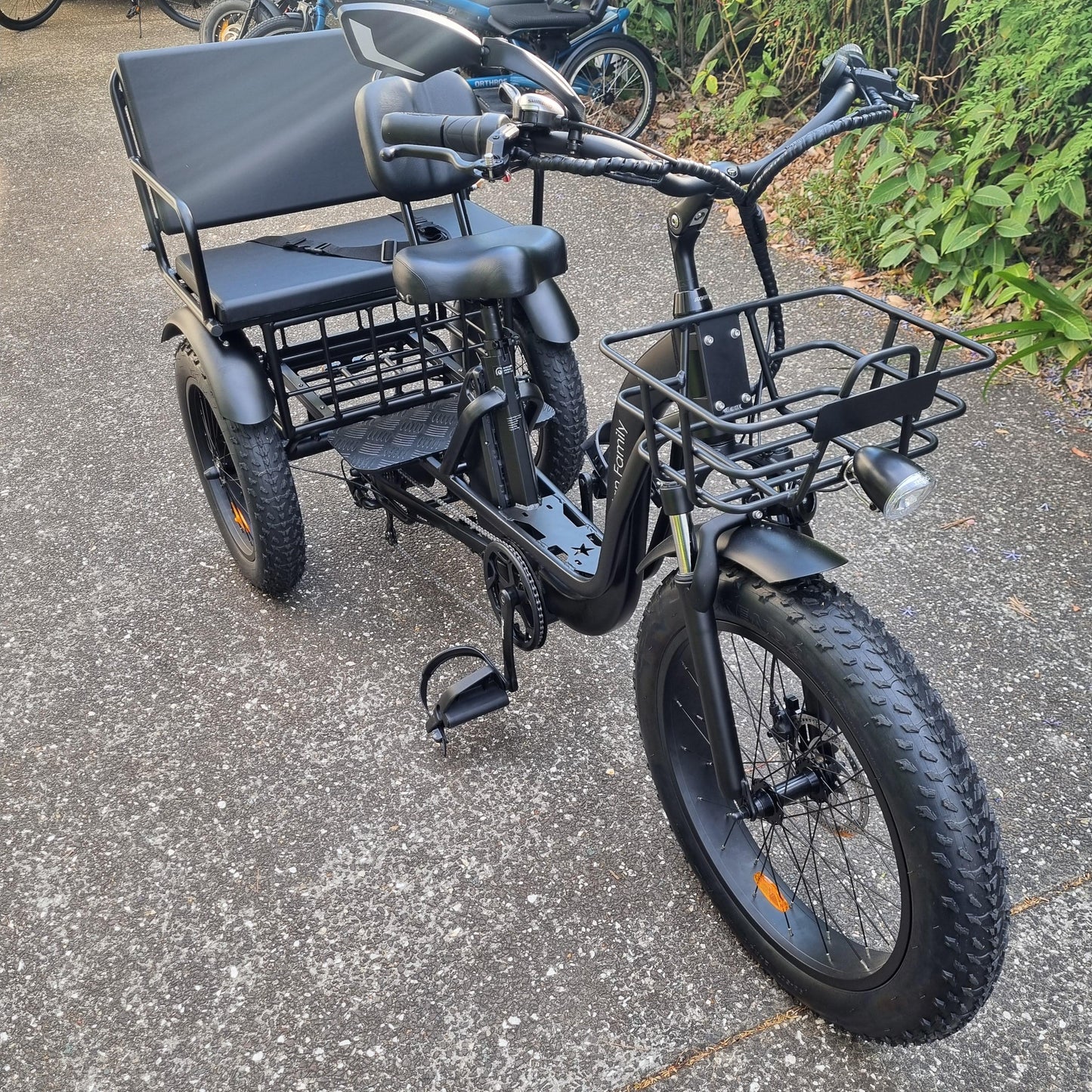 Front shot of a black electric trike - Trojan Family