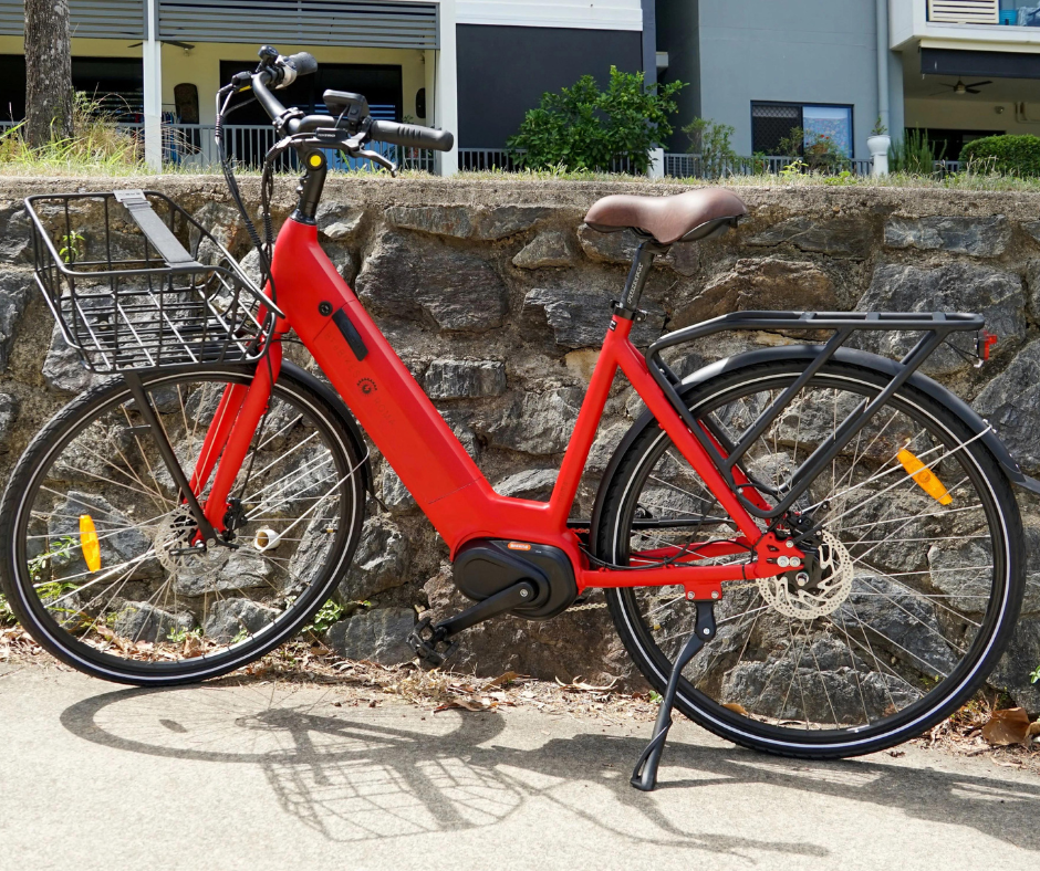 Lady happily riding yellow kalkhoff ebike