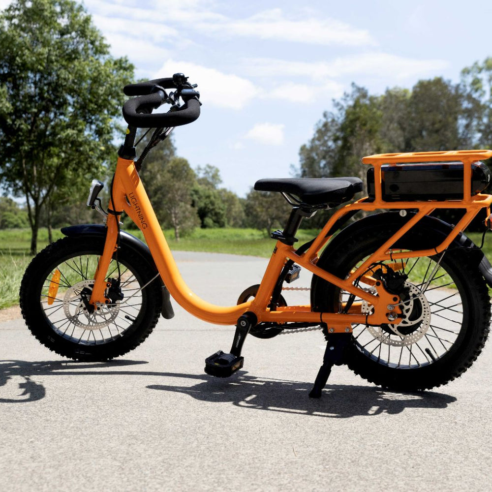 
                      
                        Orange lightning electric bike for short statured riders
                      
                    