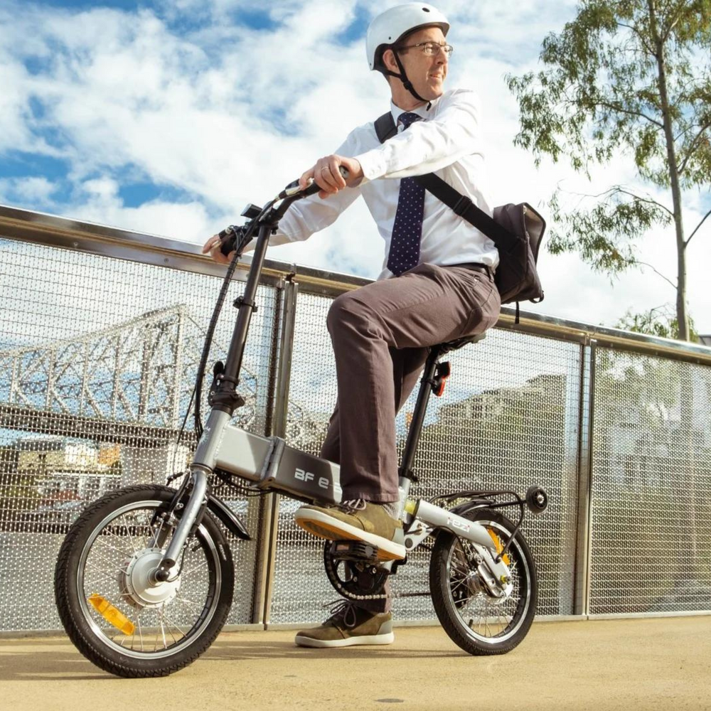 Man riding electric bike through the city