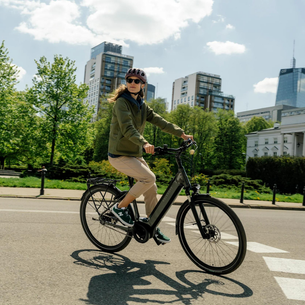 Women riding electric bike outside