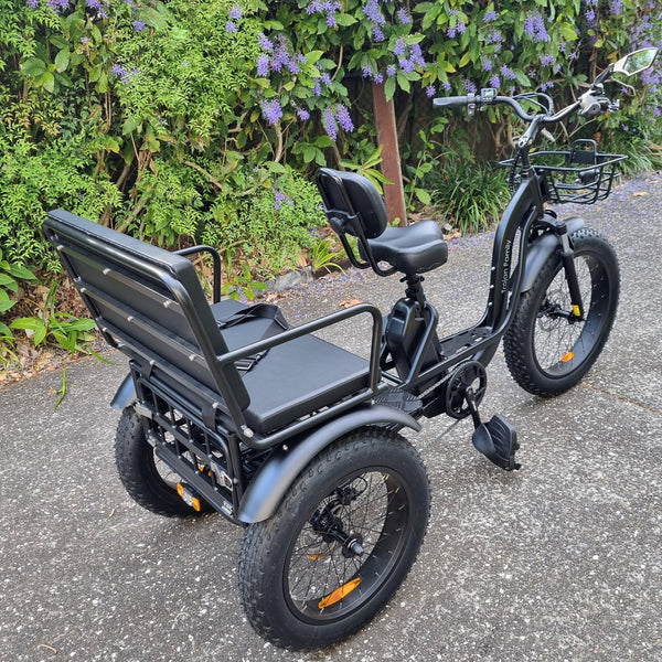 Black Electric Trike, The Trojan Family showing off the passenger seating and fat tyres.