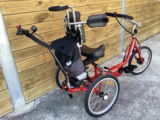 Back view of red special needs electric tricycle