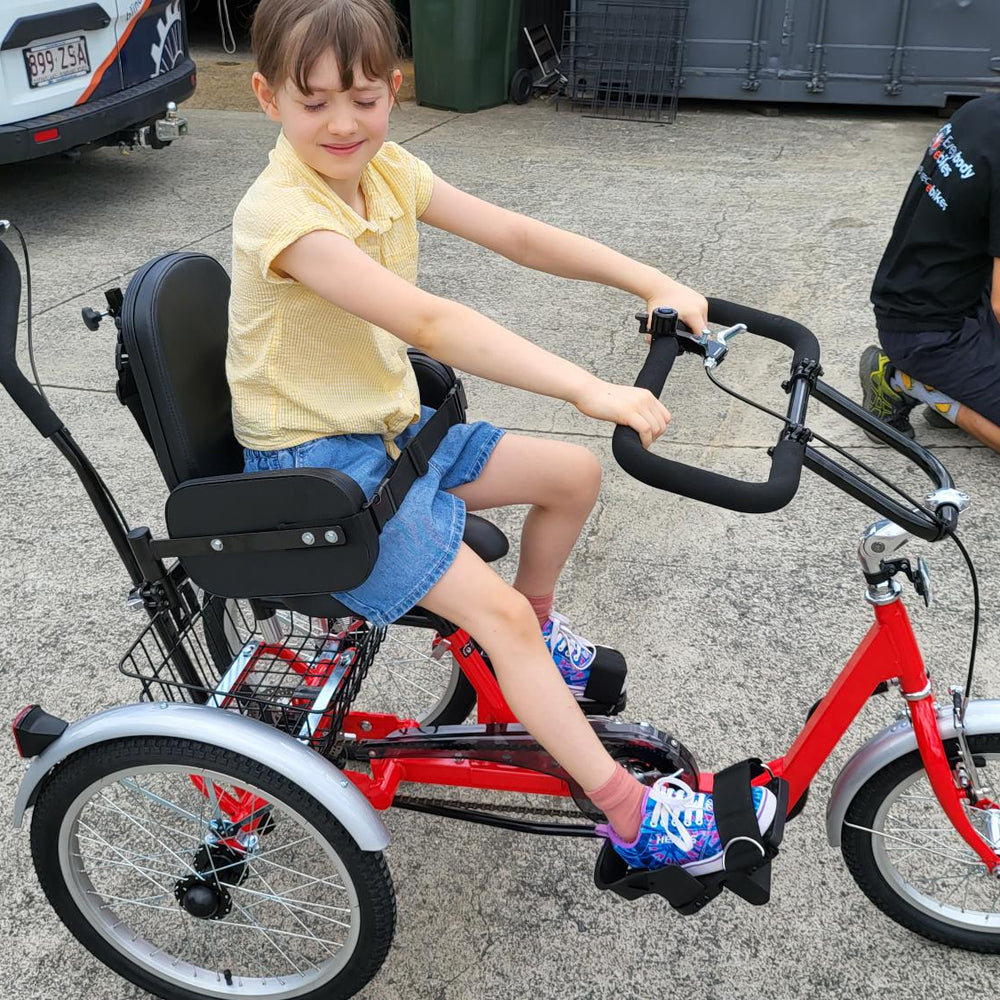 
                      
                        Young girl on Muskateer 16" rear steer mechanical tricycle
                      
                    