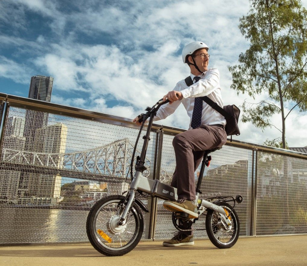 
                      
                        Man riding the BF i-Ezi Folding Electric Bike in the city
                      
                    