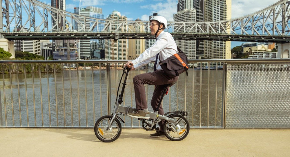 
                      
                        Man riding the BF i-Ezi Folding Electric Bike int he city
                      
                    