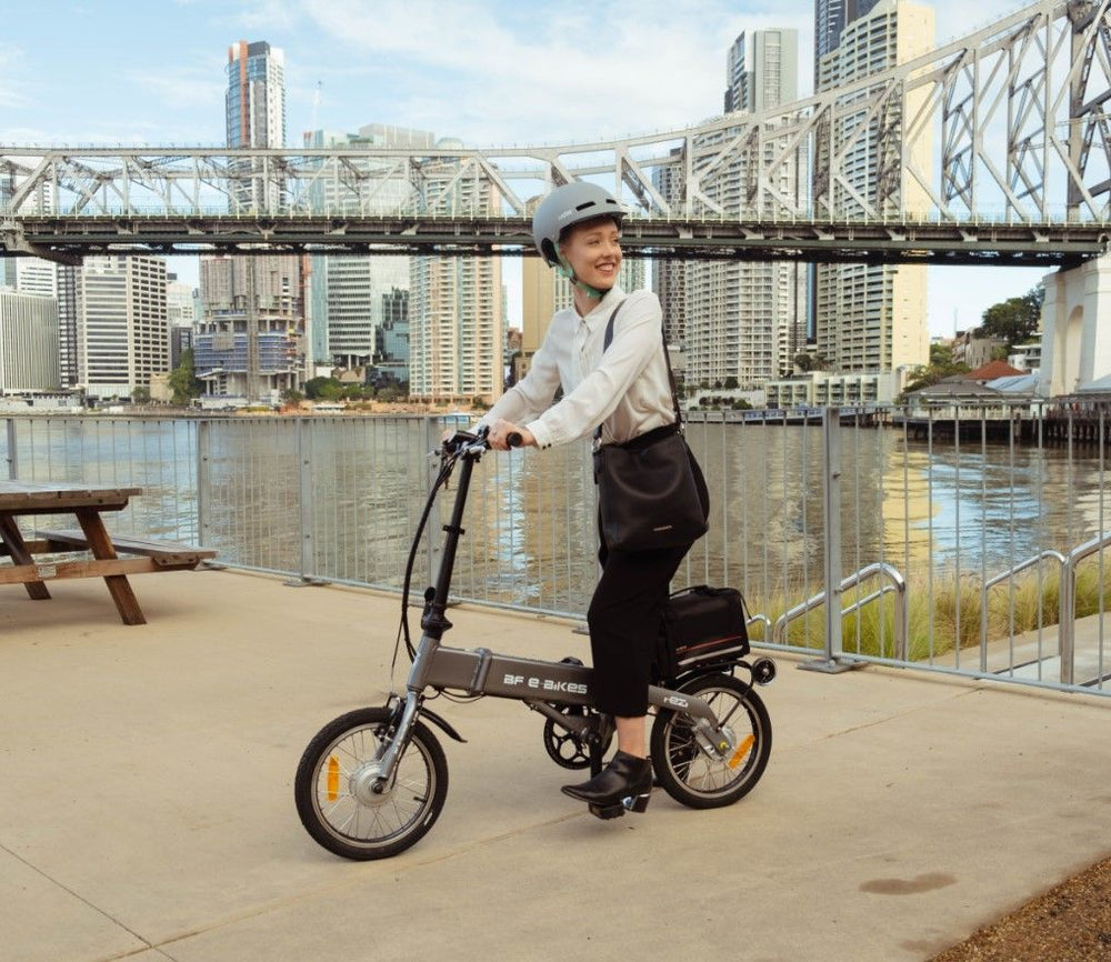 
                      
                        Lady riding the BF i-Ezi Folding Electric Bike in the city
                      
                    