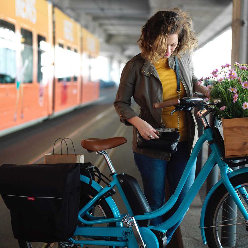 Blue Benno EJoy electric cargo bike with flowers at front