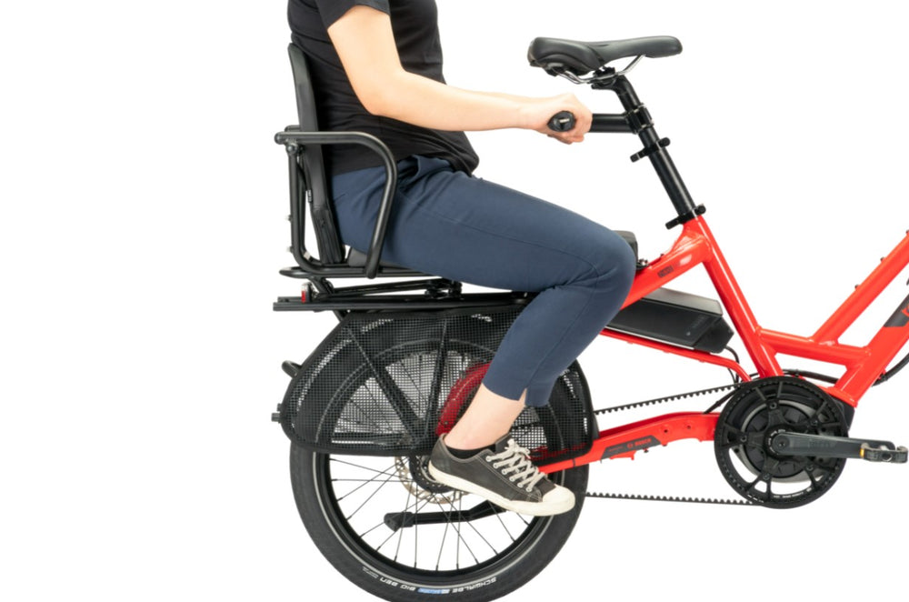 
                      
                        Person sitting on the back of a Information on the Tern GSD S10 LX Electric Cargo ebike
                      
                    