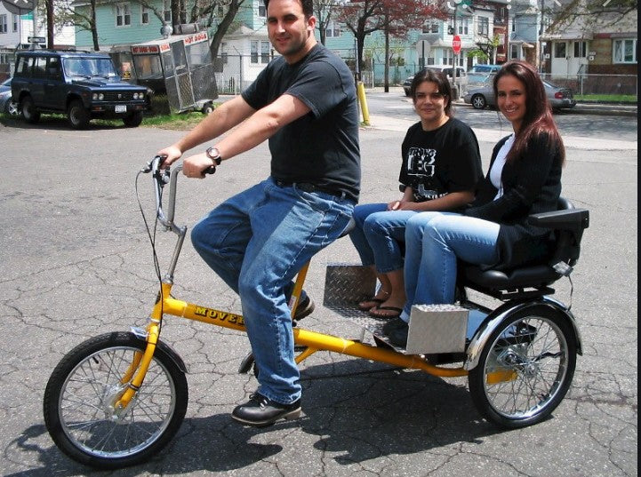 
                      
                        Happy people riding a Worksman Chariot electric tricycle
                      
                    