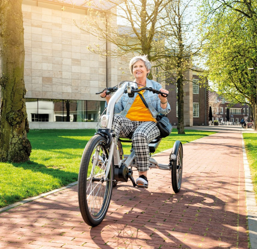 Elderly women riding the Huka Cortes Electric Tricycle 